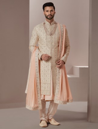 Peach hue raw silk groom wear sherwani