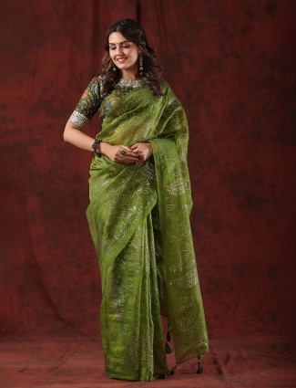 Stunning dark green organza saree