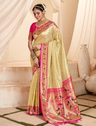 Cream tissue silk saree with contrast border